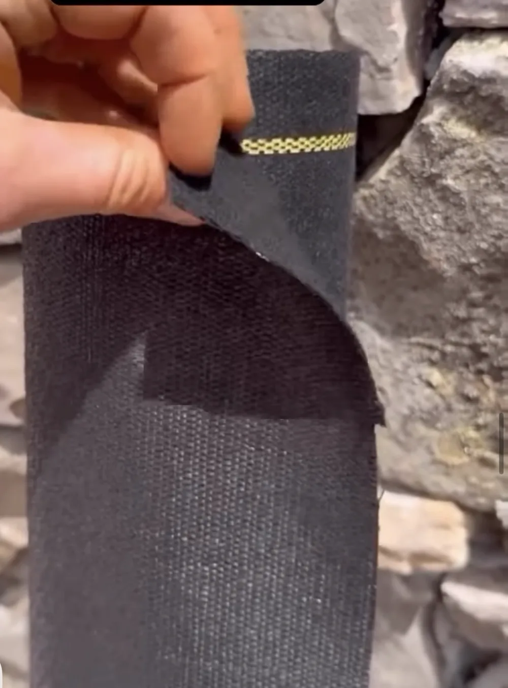 Yellow guide line woven into the fabric