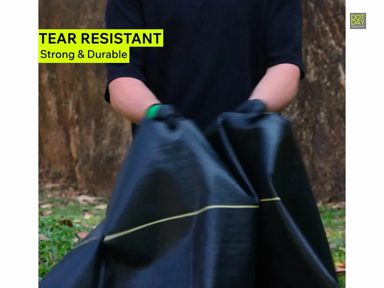 Hands pulling SHIELD fabric to show its tear resistance