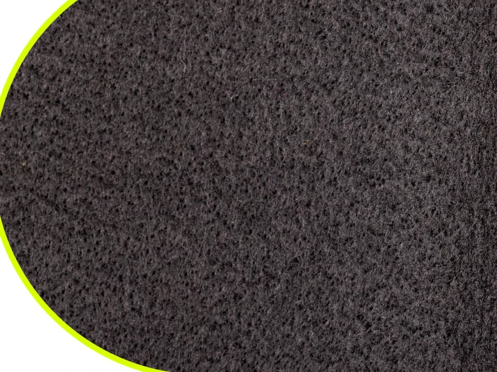 Macro close-up of the soft non-woven backing layer of DOTDAY XBAR dual-layer woven fabric