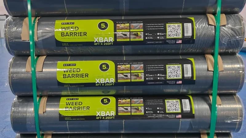 Pallet of DOTDAY XBAR 5 oz dual-layer weed barrier rolls, the product line covered by Landscape Management