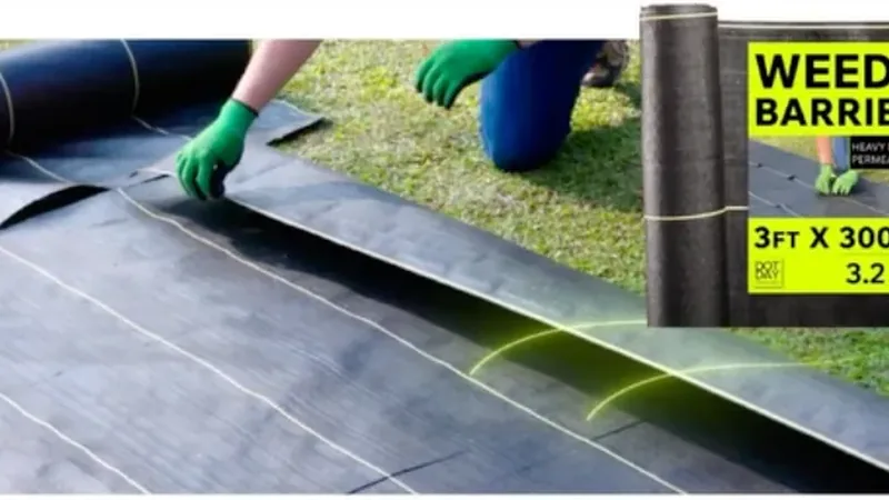 DOTDAY weed barrier fabric being installed, with a 3.2 oz SHIELD roll