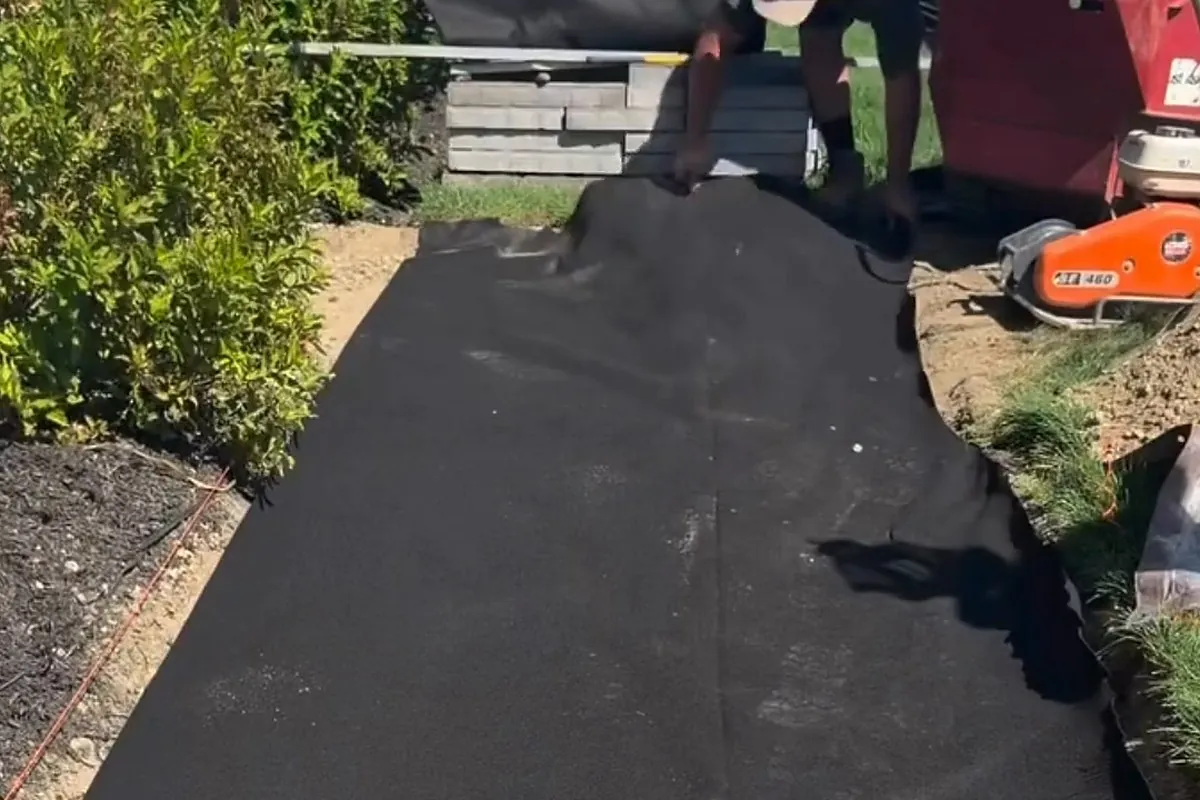 DOTDAY TERRA non-woven filter fabric laid flat in an excavation before stone goes on top