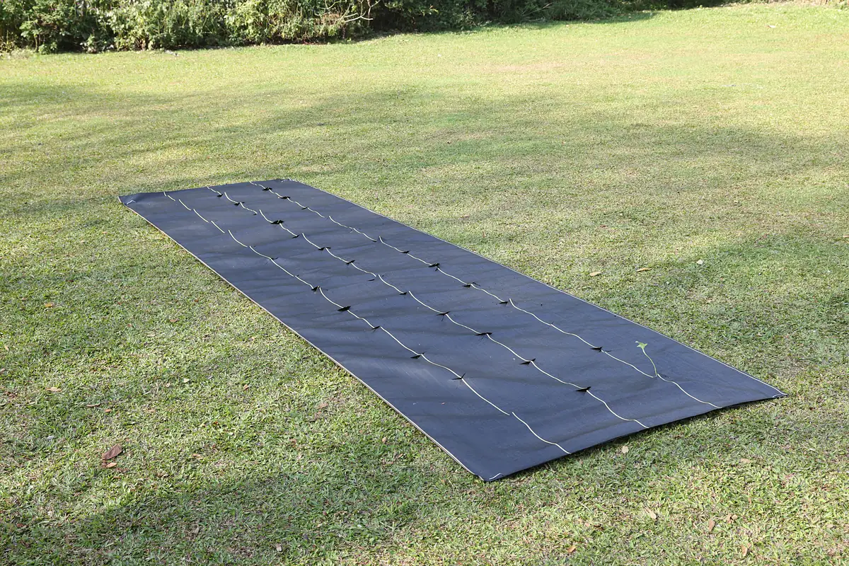 SHIELD woven landscape fabric in a planted bed, the weed-barrier job vs geotextile drainage
