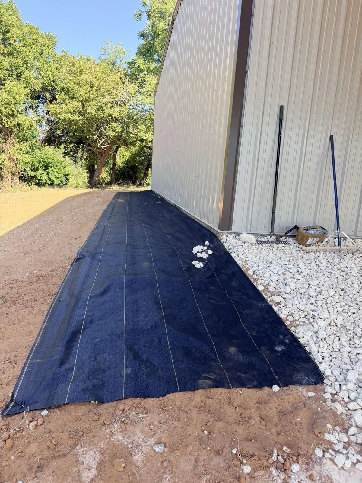 DOTDAY XBAR rolled out straight along a building with its edge running to the gravel line