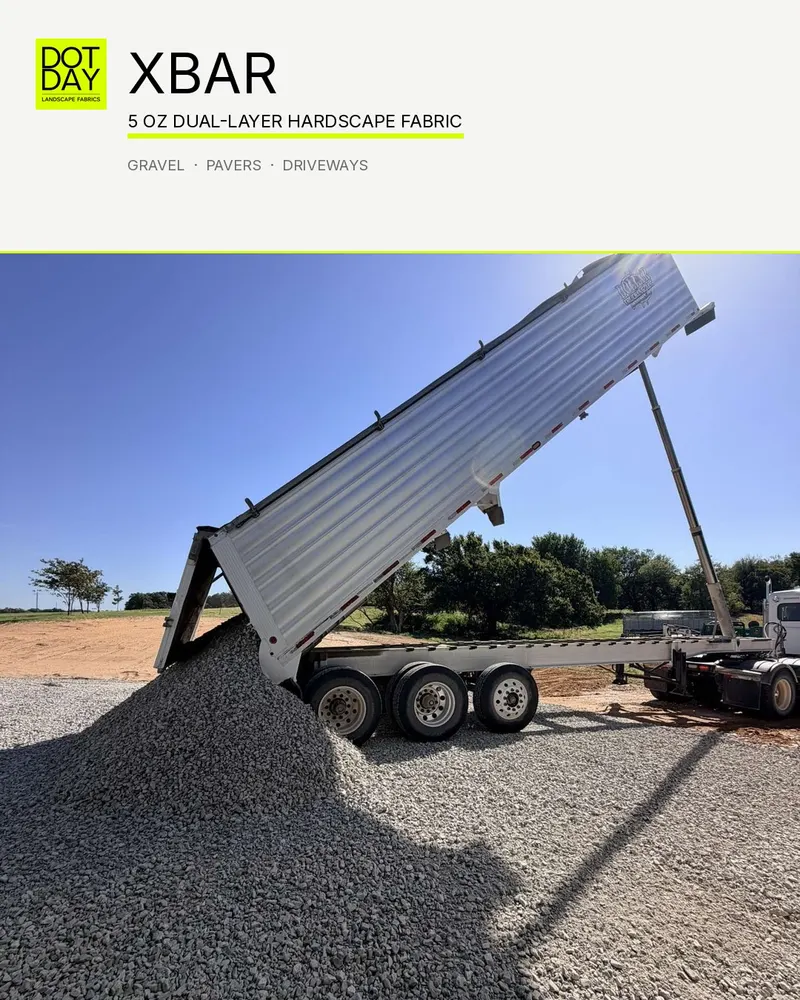 End dump trailer tipping a load of crushed gravel onto a driveway base laid over DOTDAY XBAR
